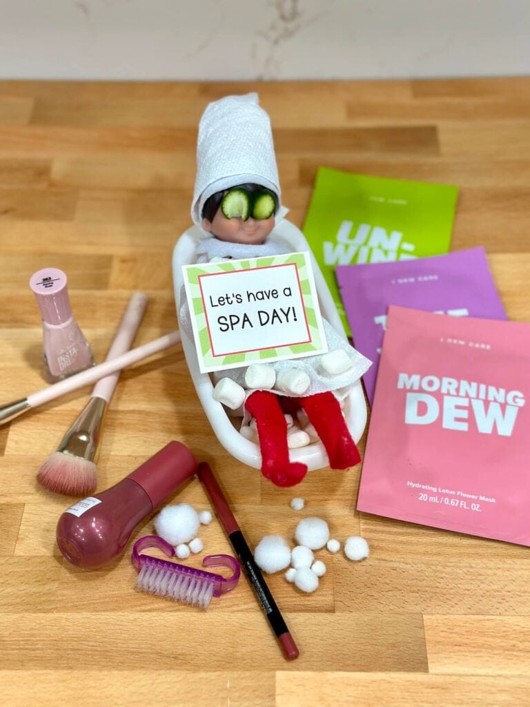 Elf on the Shelf in a toy bathtub with marshmallows for a spa day