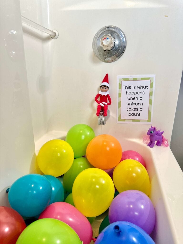 Elf on the Shelf with a bathtub full of balloons