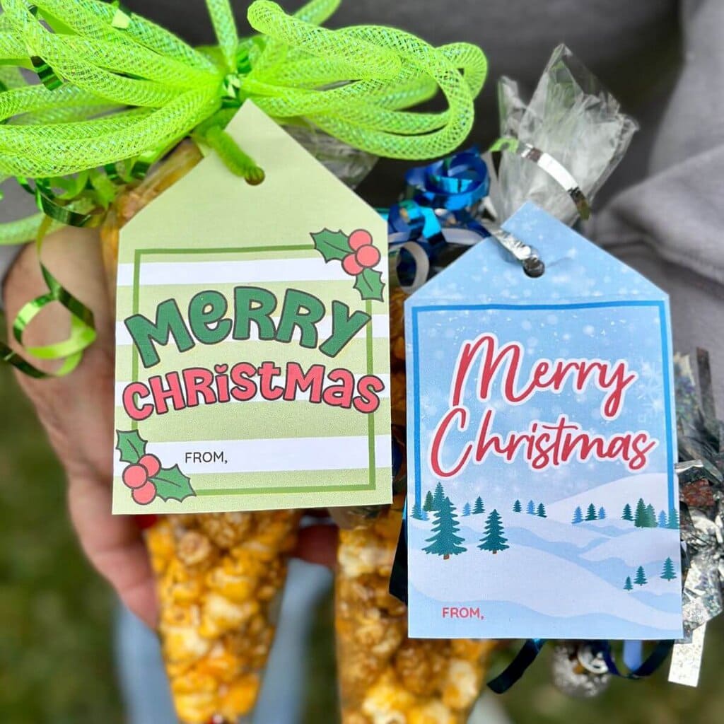 free printable Christmas gift tags that says Merry Christmas tied on small gifts