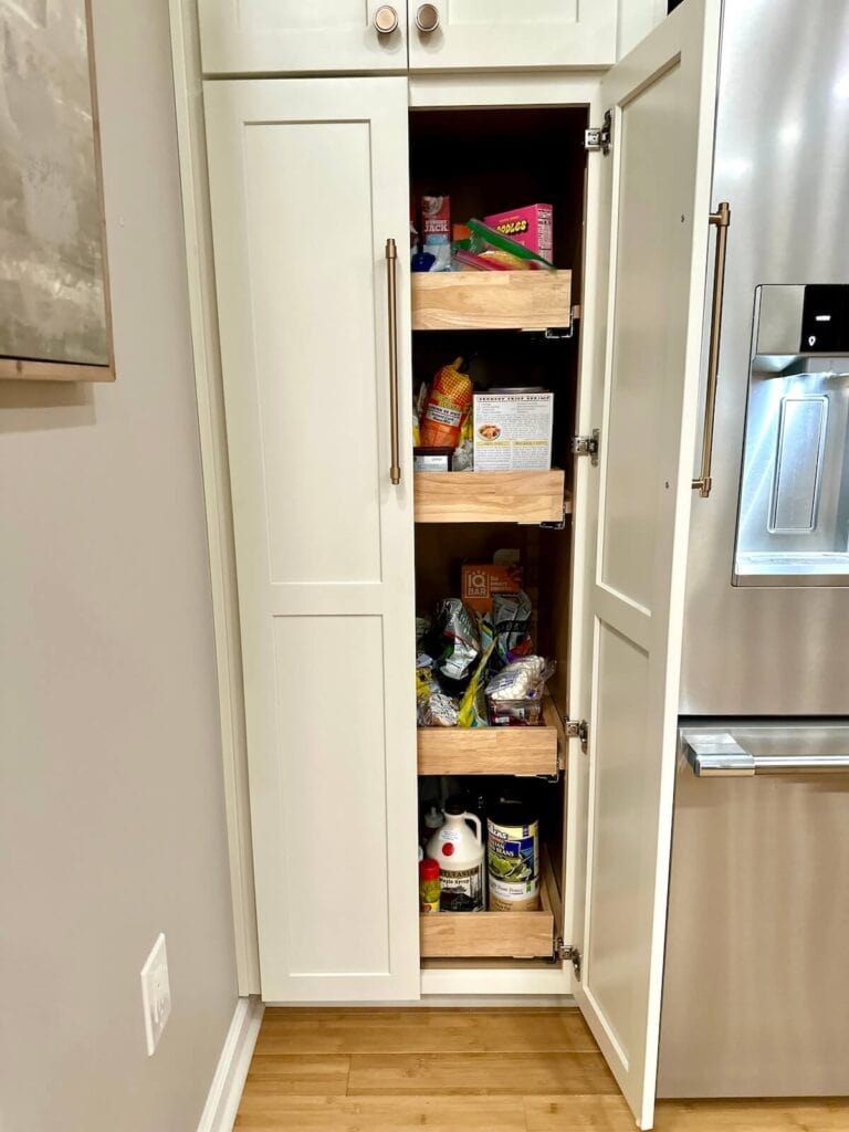 cluttered pantry cabinet with pull out shelves