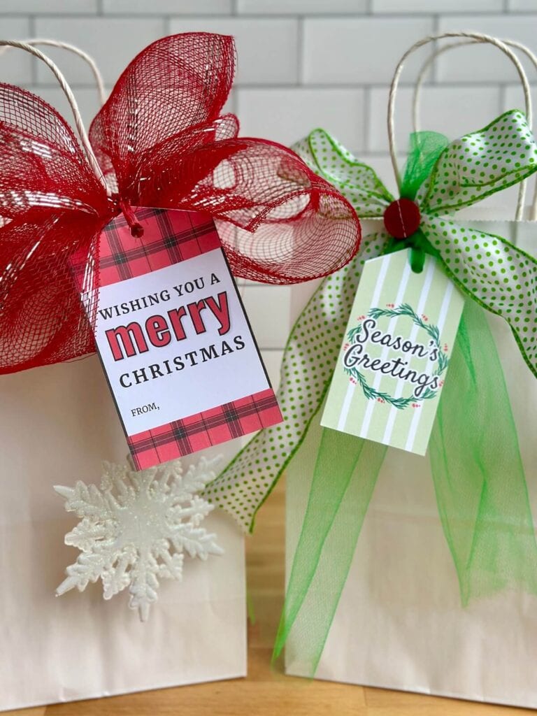 Christmas gift tags to print tied onto gift bags with pretty ribbon