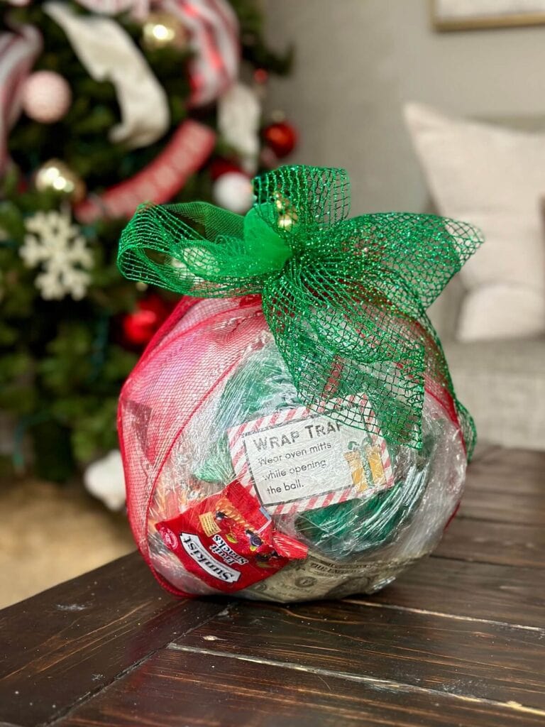 saran wrap ball game with prizes inside and a bow on top