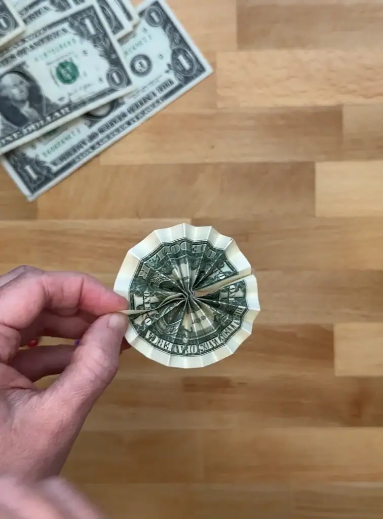 dollar bills folded in a circle shape
