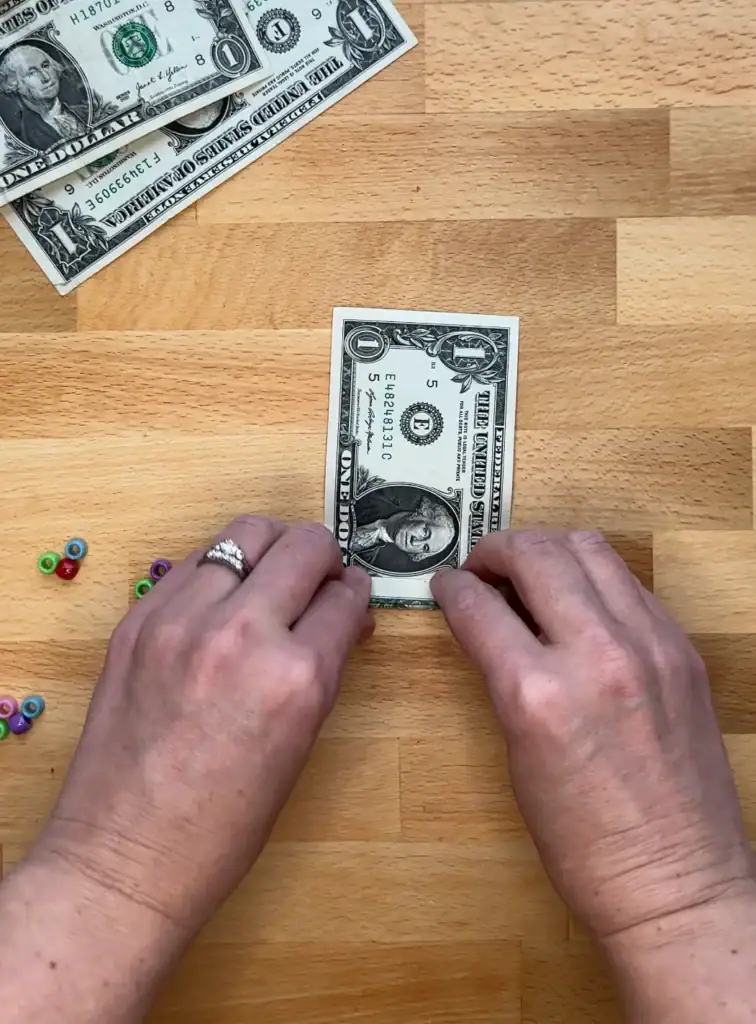 folding a dollar bill accordion style