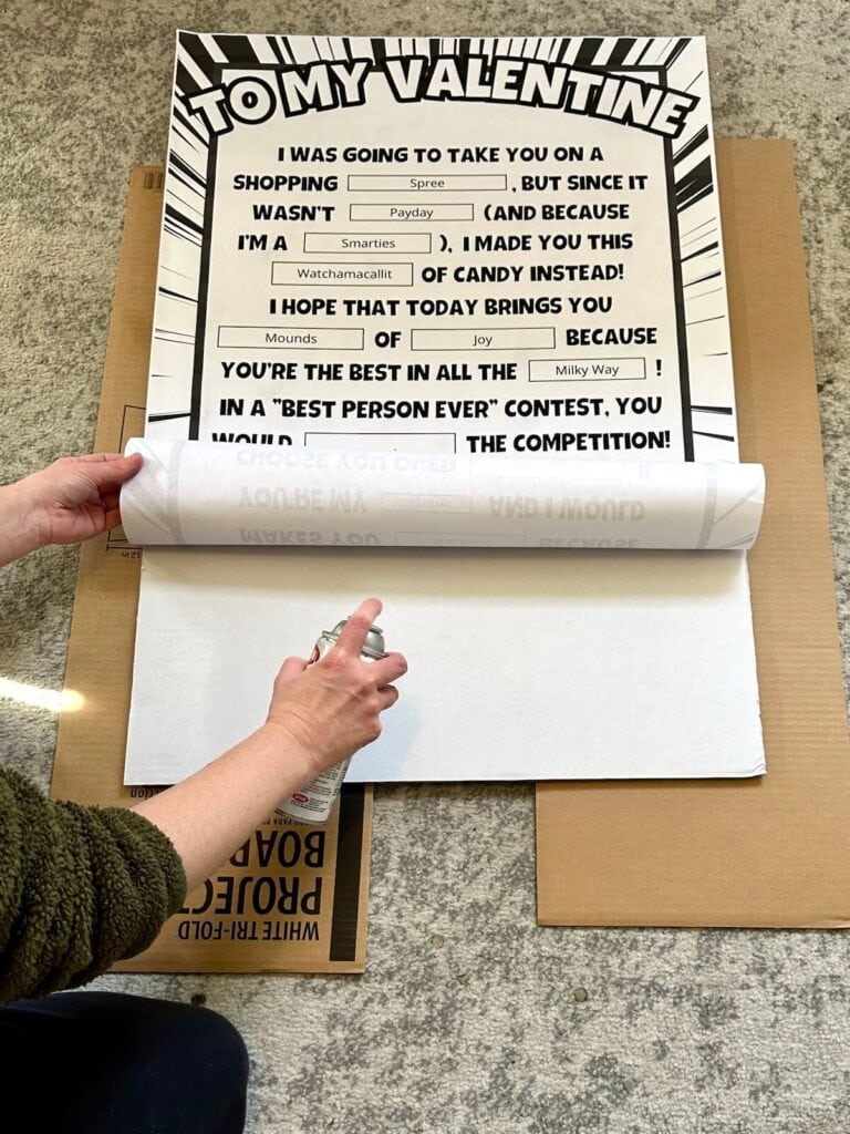 gluing a printable Valentine candy gram onto a poster board