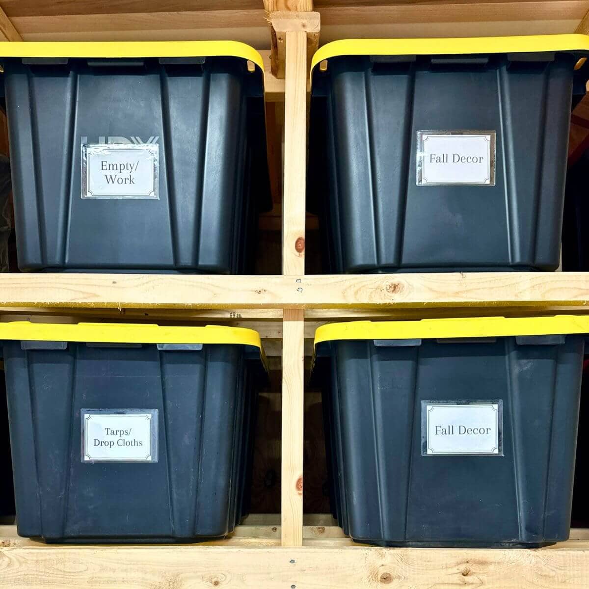 neatly organized garage storage bins with labels
