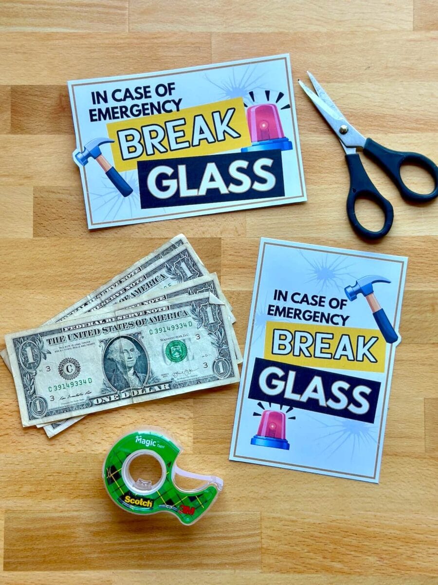 dollar bills, scissors, tape, and printable tags that say "in case of emergency break glass"