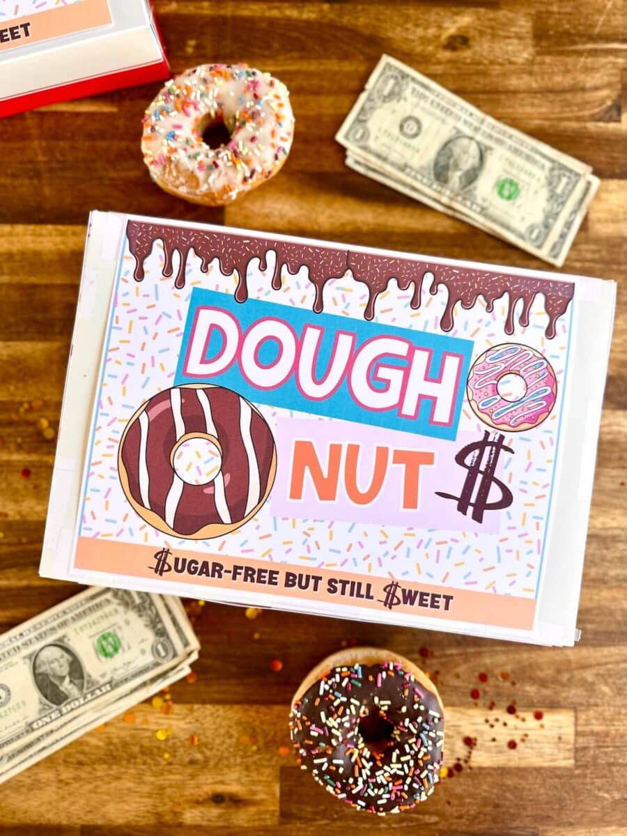 donut box with a printable sign on top that says "dough-nuts" with dollar bills