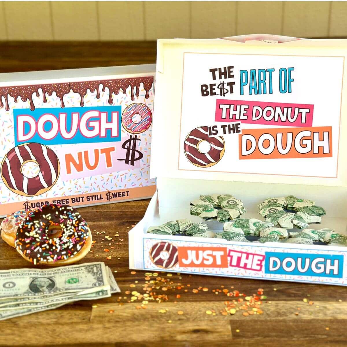 money gift with printable signs in a donut box that says "the best part of the donut is the dough"