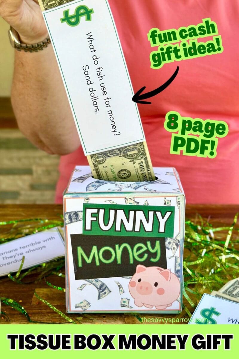 pulling dollar bills out of a tissue box that has signs on it that say "funny money"