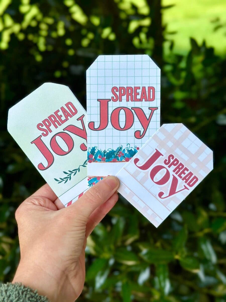 3 different Christmas gift tags that say Spread Joy