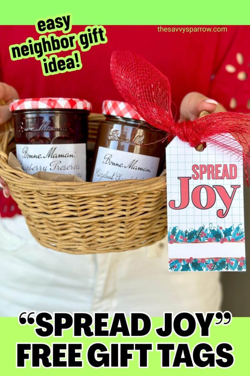 a basket of jars of jams with a Christmas gift tag that says spread joy