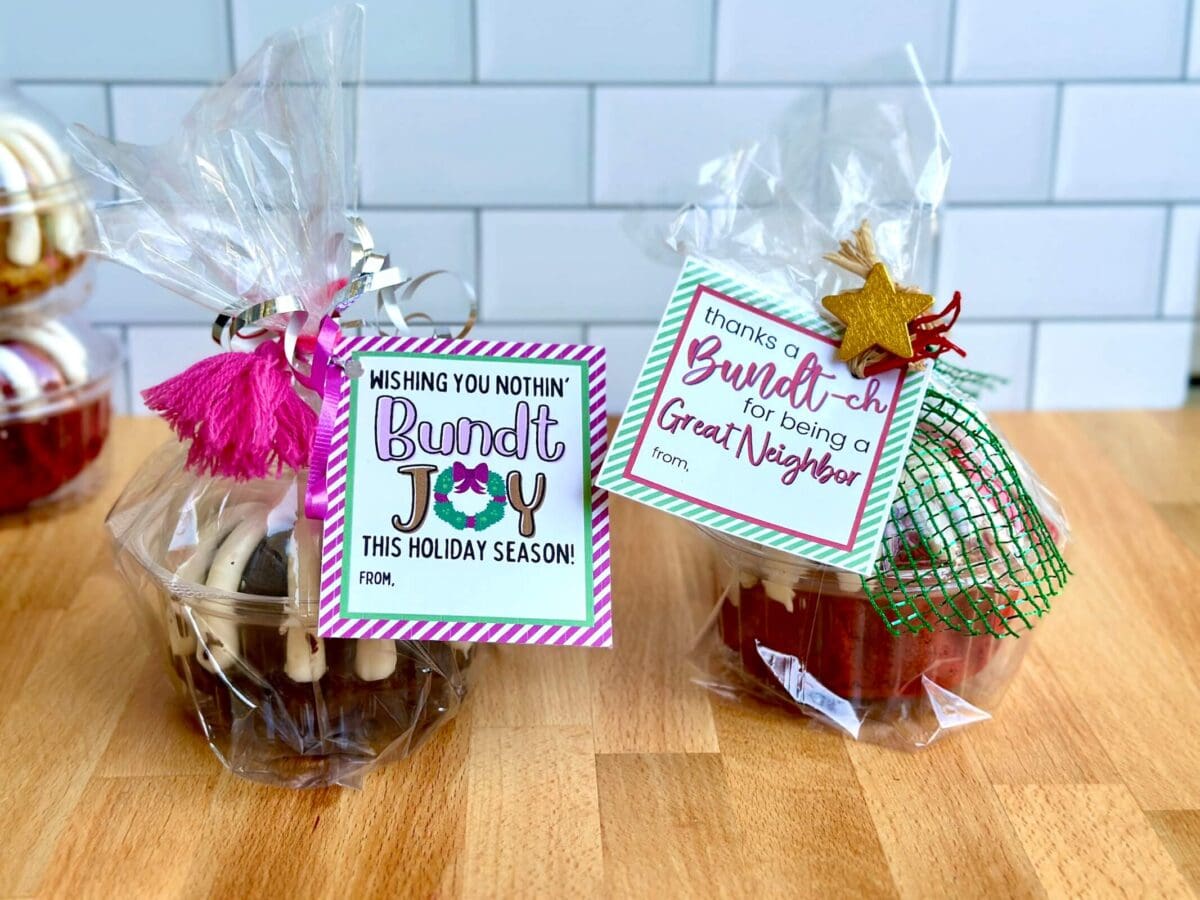 two mini bundt cakes packaged up with ribbon and printable Christmas gift tags