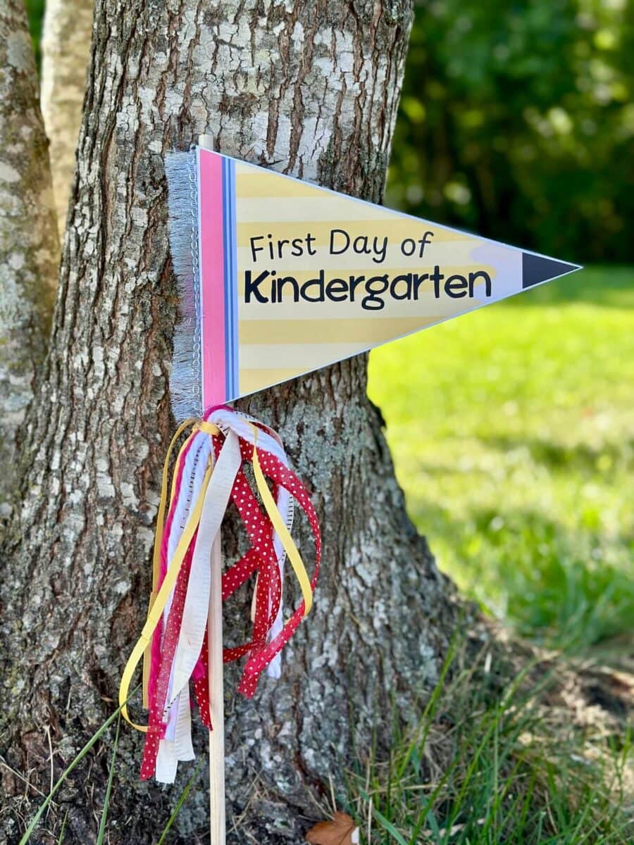 pennant flag with a pencil design that says first day of kindergarten