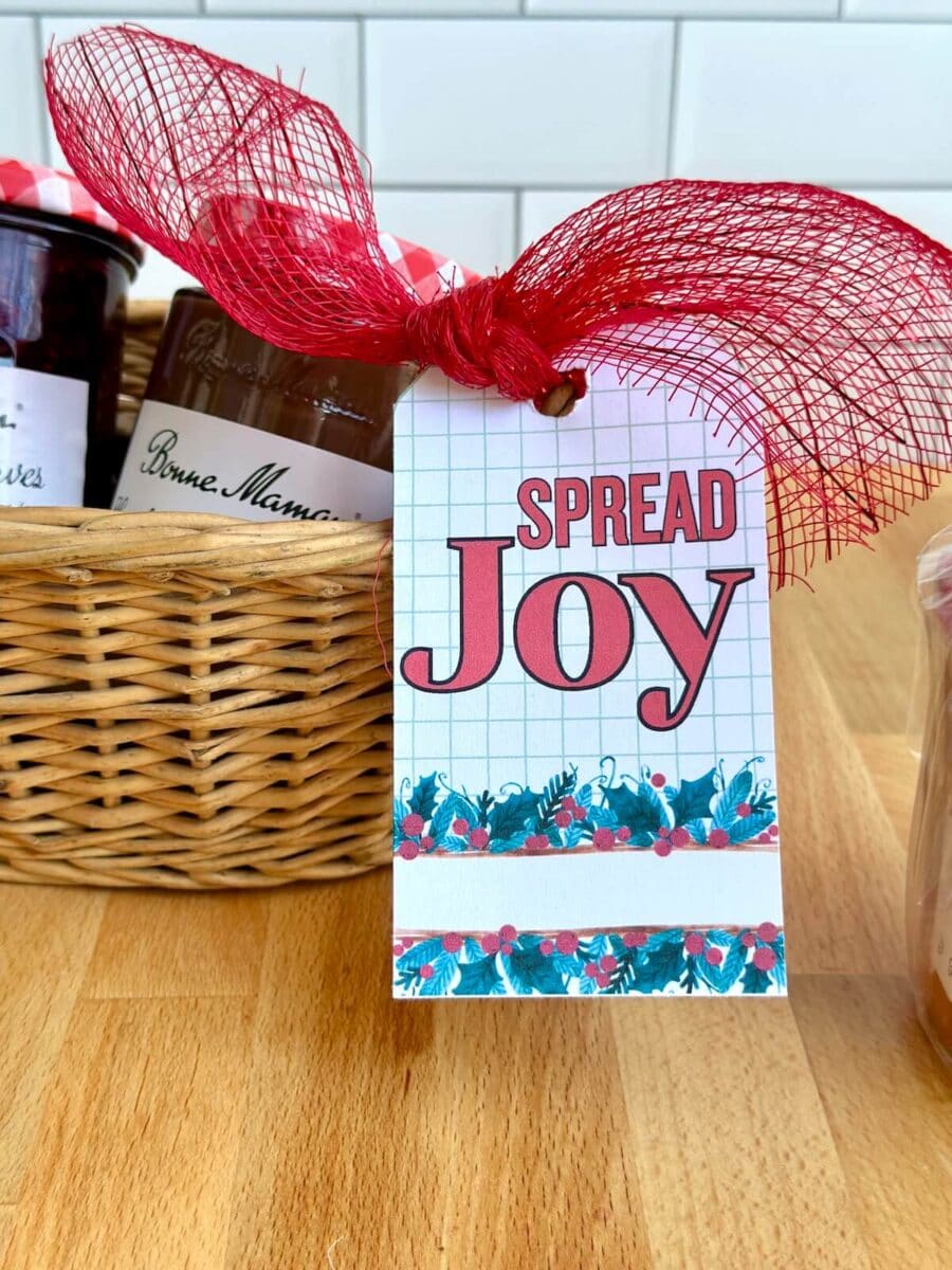 gift basket with jars of jam and a gift tag that says "Spread Joy"